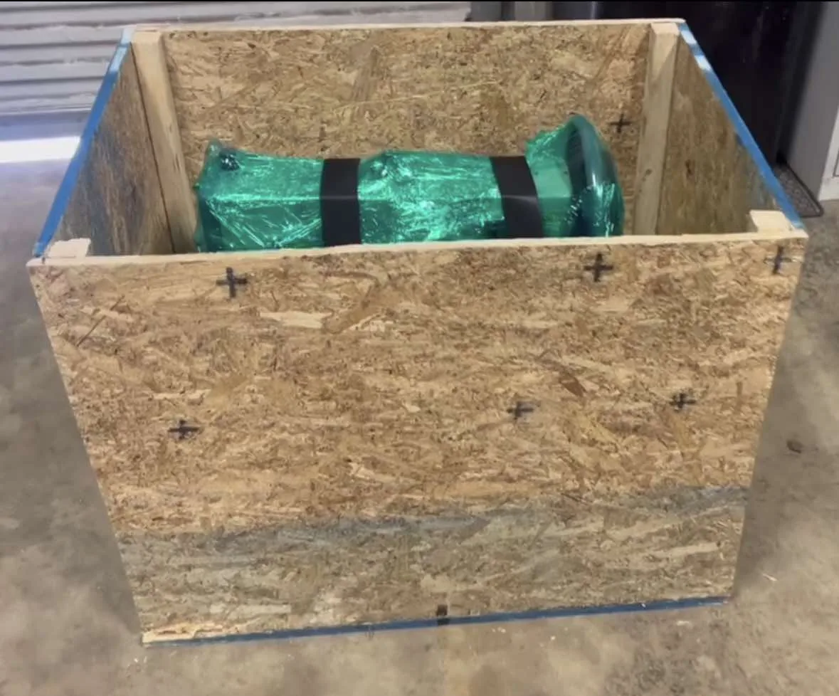 Portable Sewing Machine wrapped and secured inside its wooden shipping crate